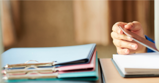 Close-up of a hand opening a notebook